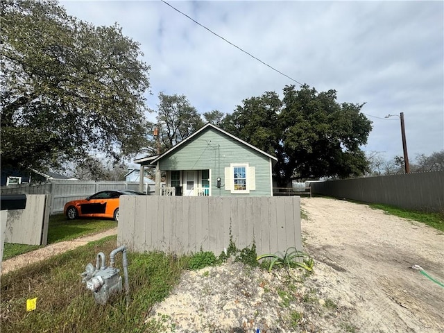 view of property exterior featuring a porch