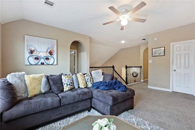 13423 Ashley Acres Ln, Cypress, TX 77429 - living room with arched walkways, vaulted ceiling, carpet flooring, ceiling fan, and baseboards
