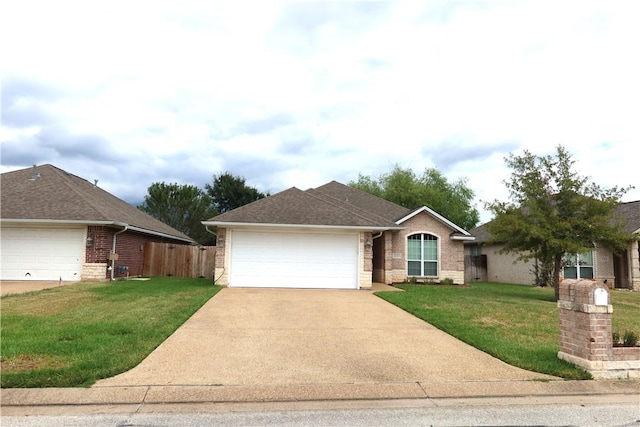 single story home featuring a garage and a front yard