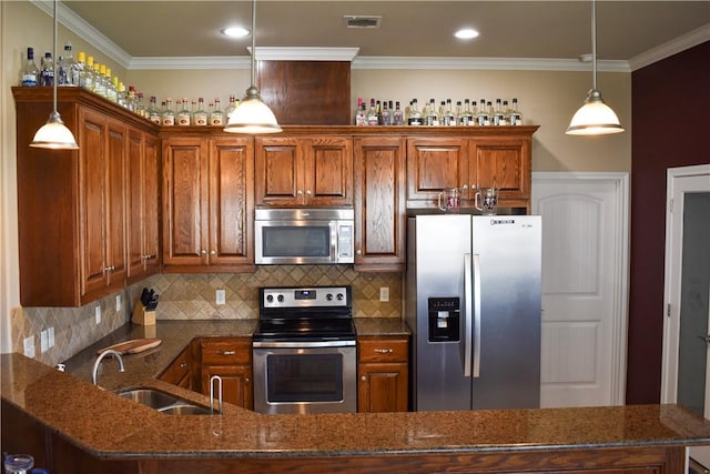 3310 Keefer Loop, College Station, TX 77845 - kitchen featuring stainless steel appliances, a sink, dark stone countertops, brown cabinetry, and crown molding