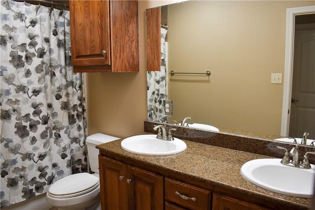 3310 Keefer Loop, College Station, TX 77845 - bathroom with toilet, double vanity, and a shower with curtain