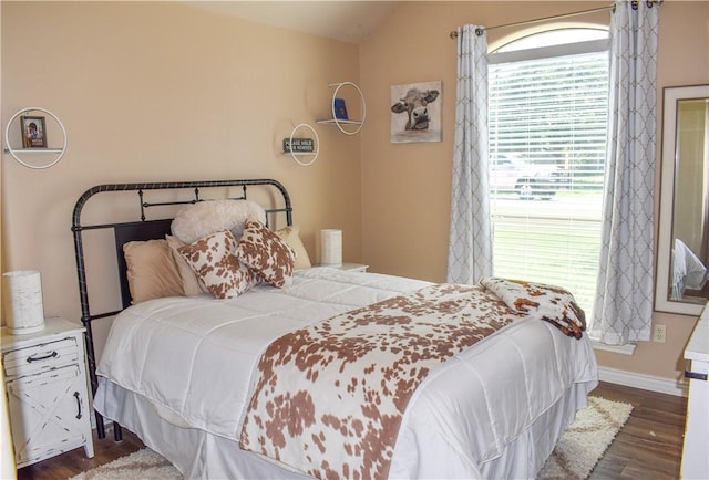 3310 Keefer Loop, College Station, TX 77845 - bedroom with dark wood-style floors, baseboards, and vaulted ceiling