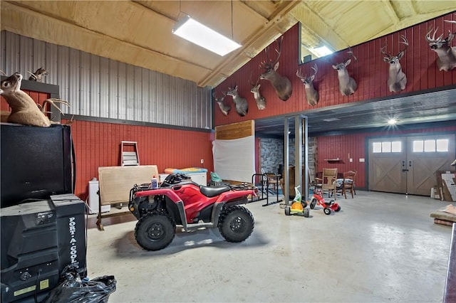 garage featuring wooden walls