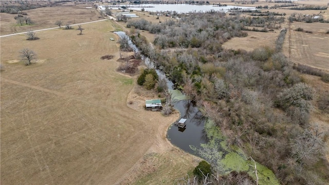 drone / aerial view featuring a water view and a rural view