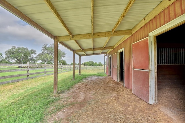 view of yard featuring an outbuilding and a rural view