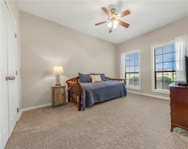 6997 Shirley Rd, Bryan, TX 77808 - carpeted bedroom with baseboards and ceiling fan