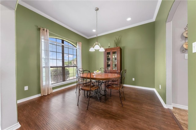 6997 Shirley Rd, Bryan, TX 77808 - dining area featuring wood finished floors, crown molding, recessed lighting, and arched walkways