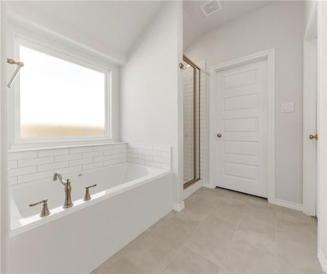 bathroom with visible vents, a garden tub, a shower stall, and tile patterned flooring