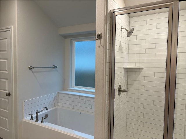 bathroom featuring plus walk in shower