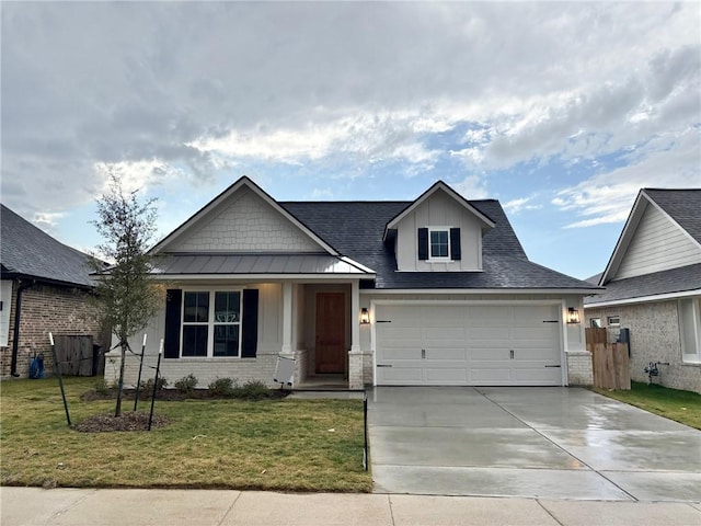 view of front of home featuring a front lawn and a garage