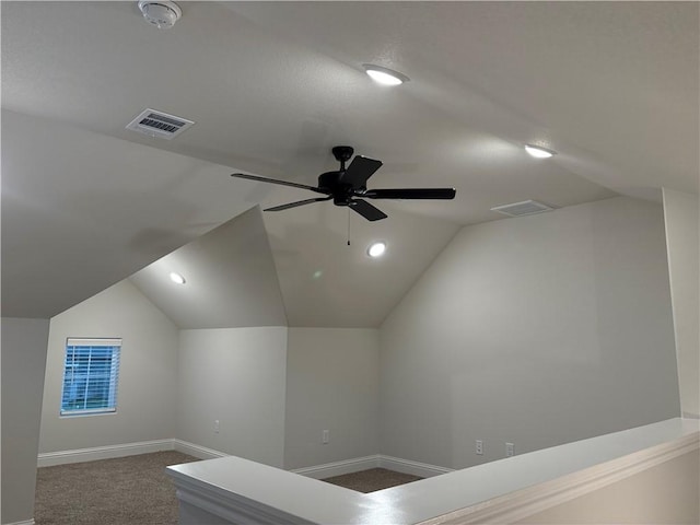 hall with carpet and lofted ceiling