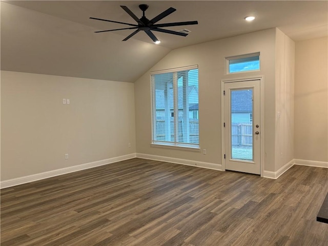 bonus room featuring vaulted ceiling, ceiling fan, and dark wood-type flooring