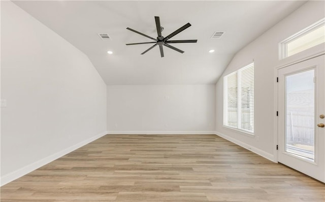 bonus room with vaulted ceiling, light wood-style flooring, baseboards, and visible vents