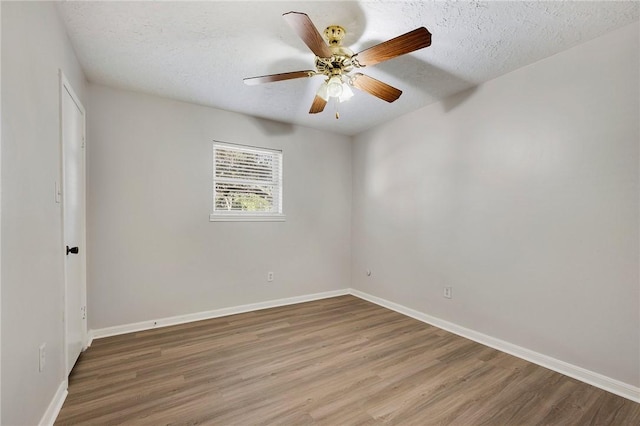 unfurnished room featuring ceiling fan, a textured ceiling, and hardwood / wood-style flooring