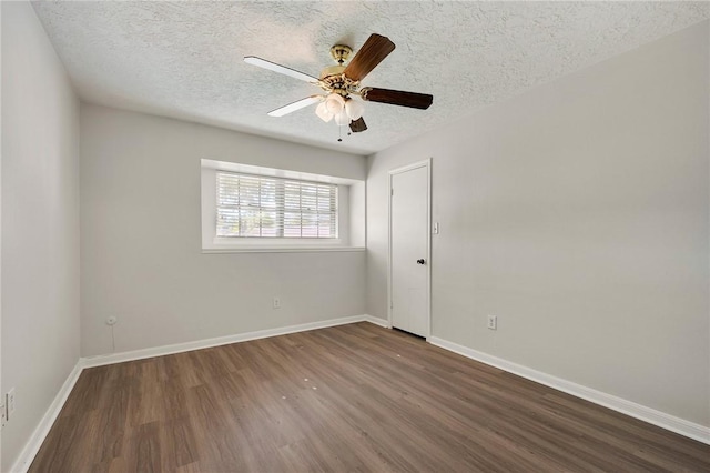 unfurnished room with a textured ceiling, dark hardwood / wood-style flooring, and ceiling fan