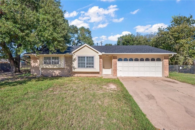 single story home featuring a garage and a front lawn