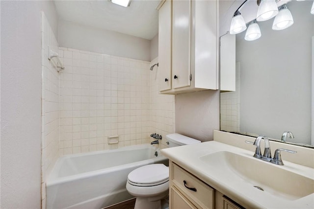 full bathroom with vanity, toilet, and tiled shower / bath