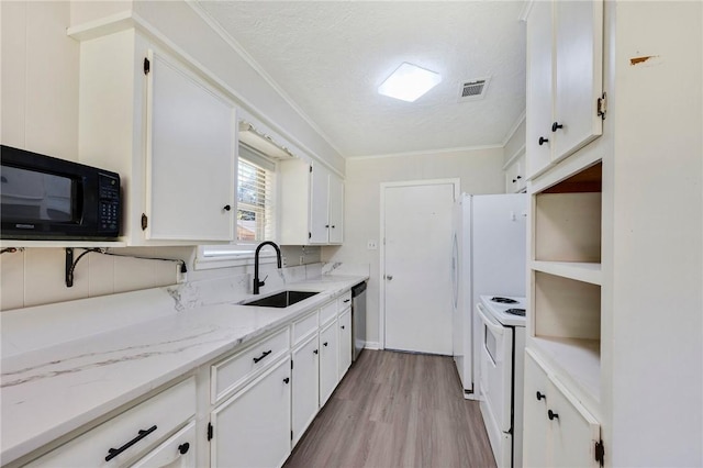 kitchen featuring dishwasher, white electric range, sink, a textured ceiling, and white cabinetry