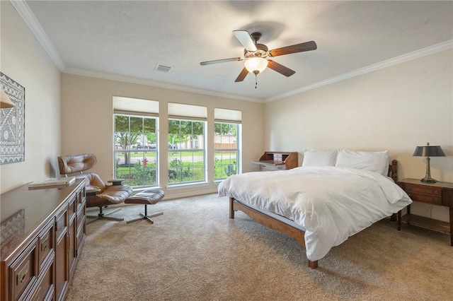 bedroom with visible vents, ornamental molding, light carpet, and a ceiling fan