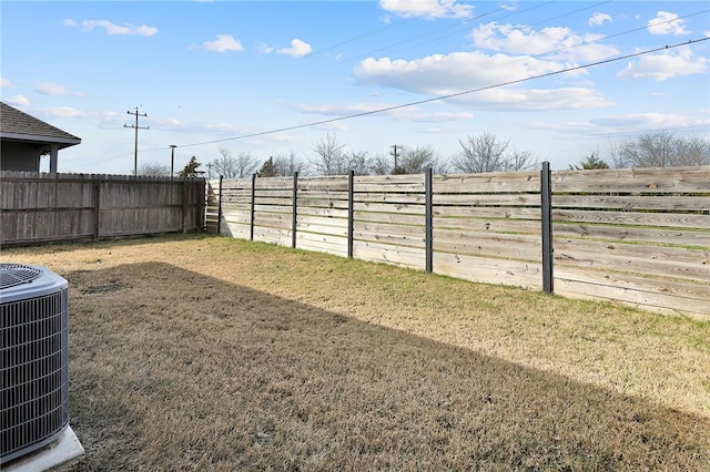 view of yard with central air condition unit