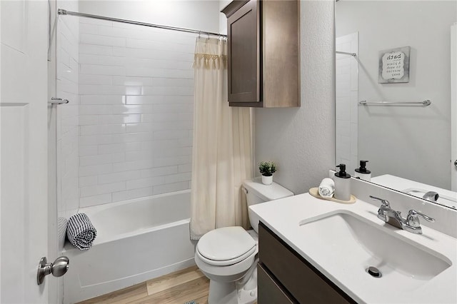 full bathroom with hardwood / wood-style flooring, vanity, toilet, and shower / tub combo with curtain