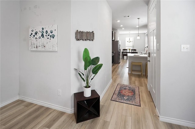 hall featuring light hardwood / wood-style floors