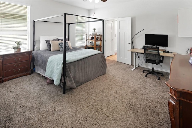 bedroom featuring light carpet and ceiling fan