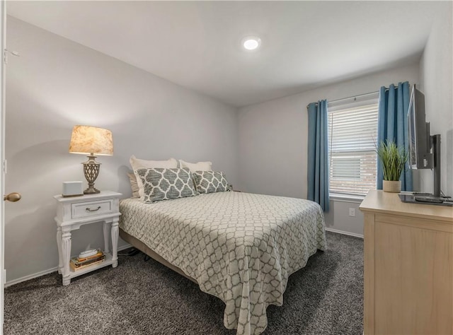2412 Divot Ln, Navasota, TX 77868 - bedroom with dark colored carpet and baseboards