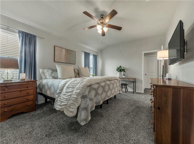 2412 Divot Ln, Navasota, TX 77868 - bedroom with dark colored carpet, ceiling fan, and baseboards