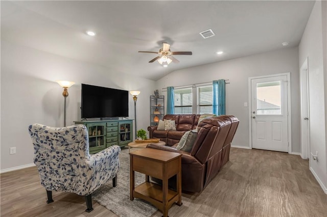 2412 Divot Ln, Navasota, TX 77868 - living area featuring wood finished floors, a ceiling fan, baseboards, lofted ceiling, and recessed lighting