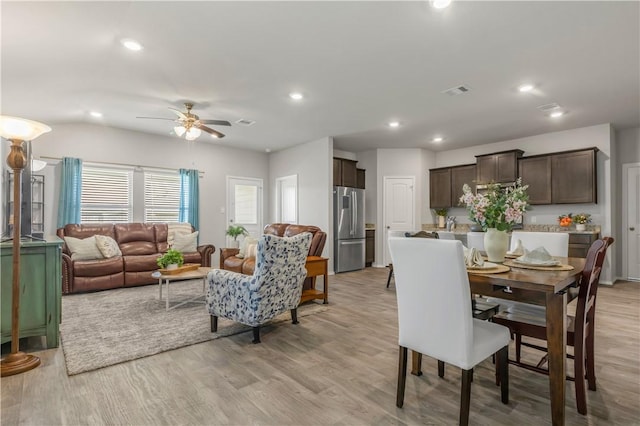 2412 Divot Ln, Navasota, TX 77868 - dining room with light wood-style floors, a ceiling fan, and recessed lighting