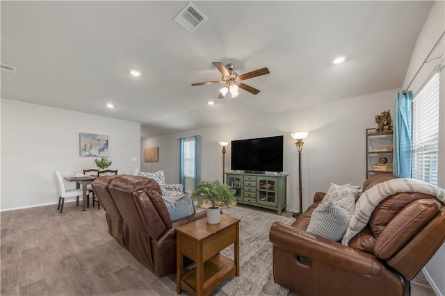2412 Divot Ln, Navasota, TX 77868 - living room with healthy amount of natural light, light wood-type flooring, a ceiling fan, recessed lighting, and baseboards