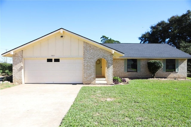 single story home with a front lawn and a garage