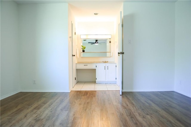 interior space featuring light wood-type flooring and built in desk