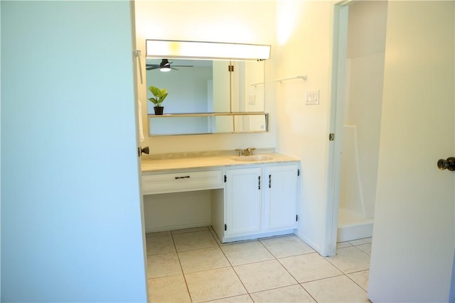 bathroom with ceiling fan, tile patterned floors, and vanity