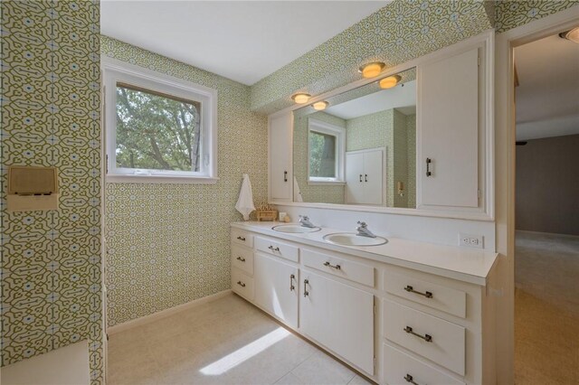 bathroom featuring a shower and vanity