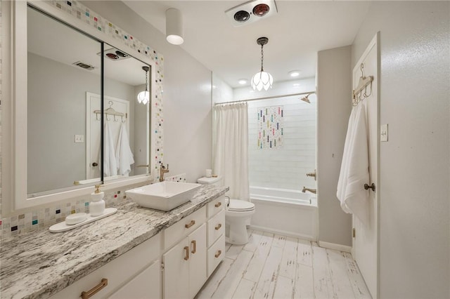 full bathroom with vanity, hardwood / wood-style flooring, toilet, and shower / bathtub combination with curtain