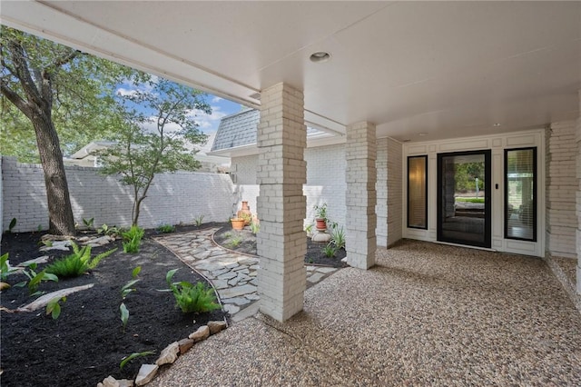 entrance to property with a patio