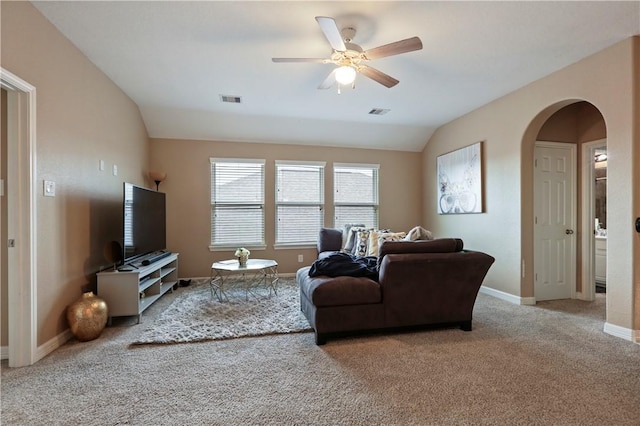 living room featuring ceiling fan, carpet, and vaulted ceiling