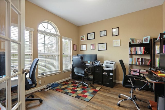 home office with wood-type flooring