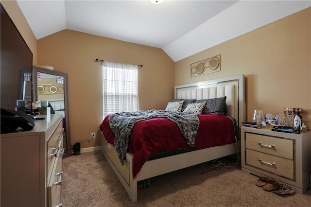 bedroom with light carpet and lofted ceiling