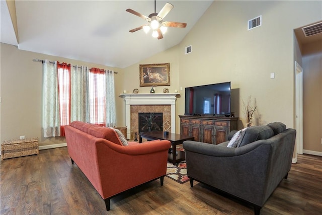 living room featuring a tile fireplace, ceiling fan, high vaulted ceiling, and dark wood-type flooring