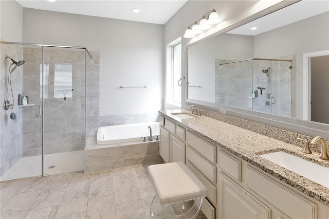 full bathroom with a garden tub, a sink, a shower stall, and double vanity