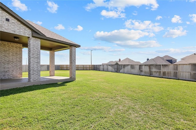 view of yard featuring a fenced backyard and a patio