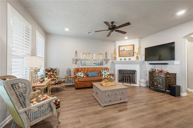 4143 Shallow Creek Loop, College Station, TX 77845 - living room with a ceiling fan, a fireplace, light wood finished floors, recessed lighting, and baseboards