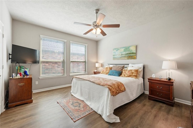 4143 Shallow Creek Loop, College Station, TX 77845 - bedroom featuring wood finished floors, baseboards, a ceiling fan, and a textured ceiling