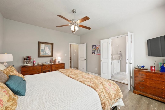 4143 Shallow Creek Loop, College Station, TX 77845 - bedroom featuring light wood-type flooring, baseboards, ensuite bath, and a ceiling fan