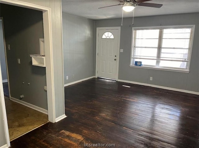 foyer entrance featuring ceiling fan and dark hardwood / wood-style flooring