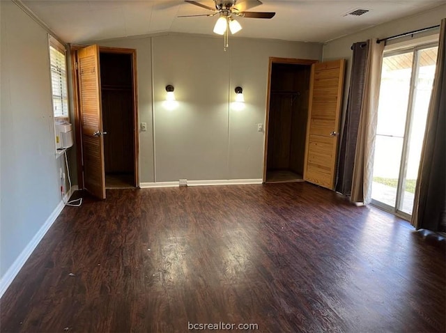 unfurnished room with lofted ceiling, ceiling fan, and dark wood-type flooring