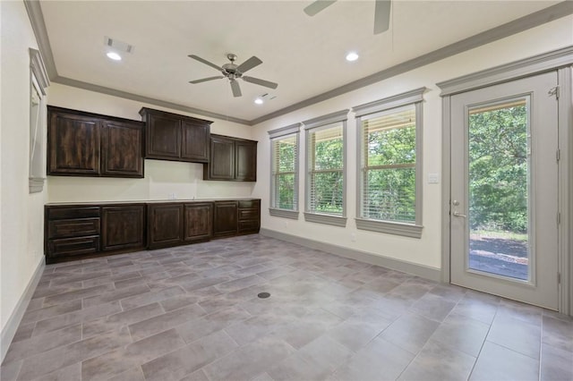 5217 Ruddy Duck Dr, College Station, TX 77845 - kitchen featuring a ceiling fan, plenty of natural light, crown molding, dark brown cabinets, and recessed lighting